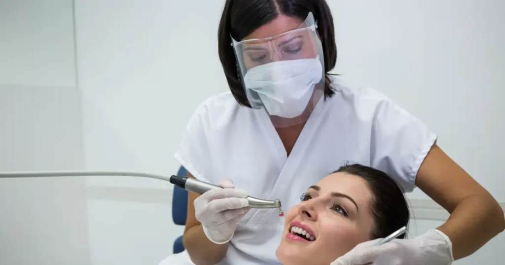 Dental Cleaning in Carmichael, CA 95608 — What Happens and Why It Matters More Than You Think 5 Dental hygienist performing professional teeth cleaning for patient in Carmichael CA 95608 at Mission Dental